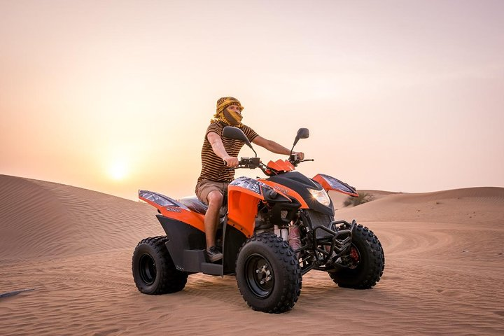 Experience the thrill of self-driving a quad bike across golden sands with breathtaking desert vistas and exhilarating dune bashing topped off by adventures like sandboarding and camel rides.